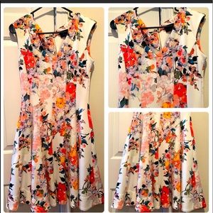 -Size 10
-Beautiful Floral Design with White Background
-Two Pockets on Sides
-